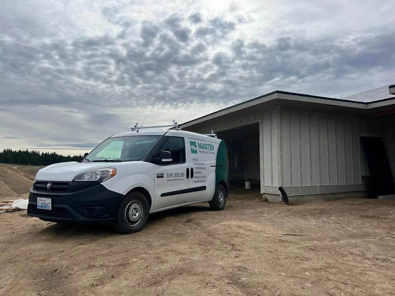 MASTER Heating and Cooling service van at a Spokane-area project