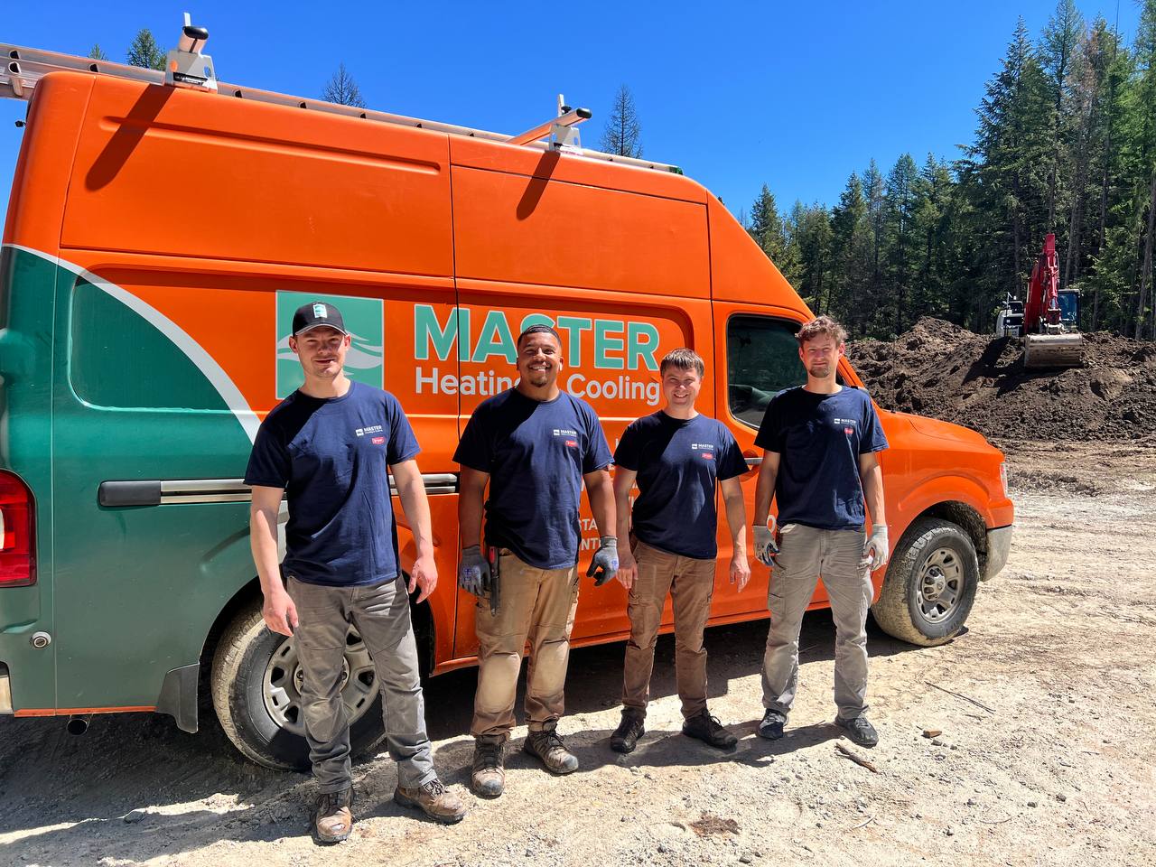 MASTER Heating and Cooling technicians beside a company service van in the Spokane area